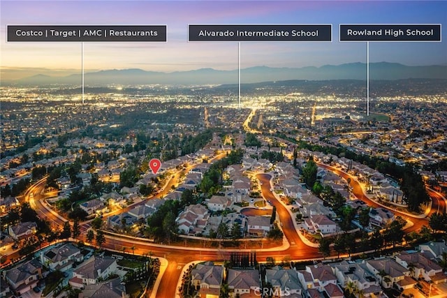 aerial view at dusk with a mountain view