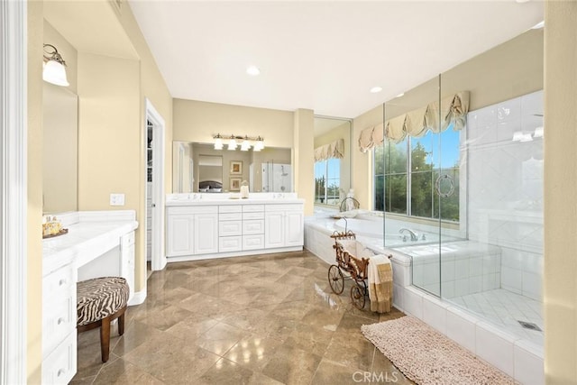 bathroom featuring plus walk in shower and vanity