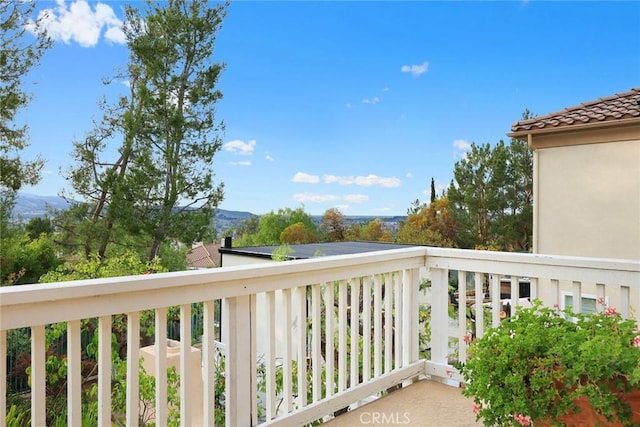 balcony featuring a mountain view