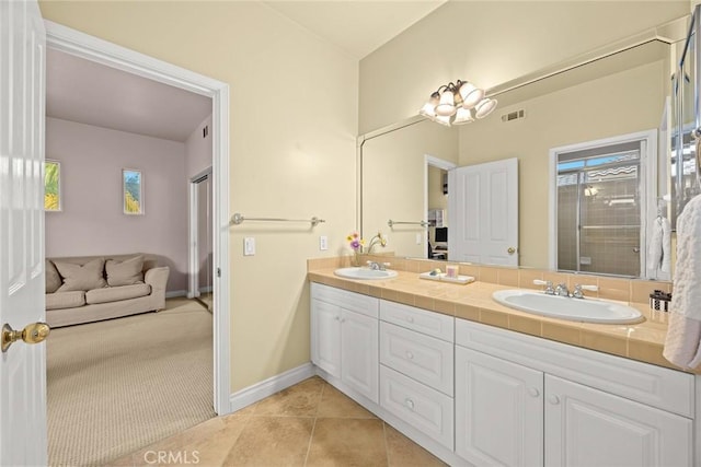 bathroom featuring tile patterned floors and vanity