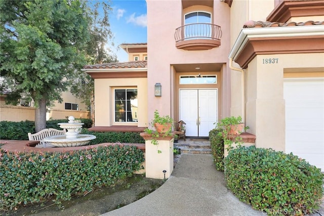 entrance to property with a balcony