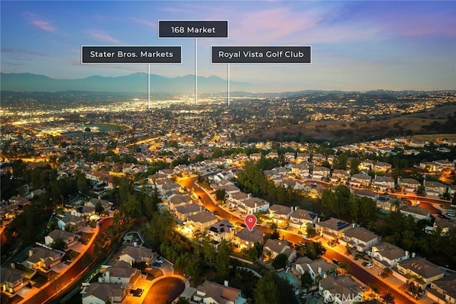 aerial view at dusk with a mountain view