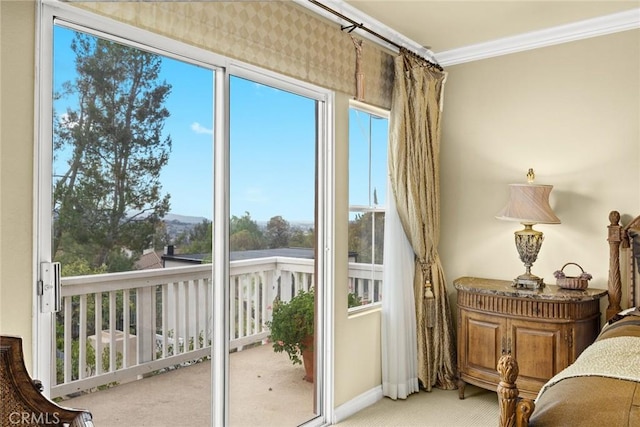 bedroom with ornamental molding and carpet