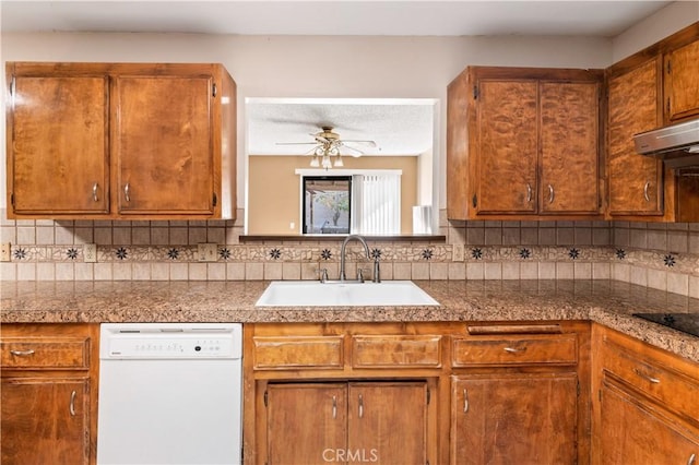 kitchen featuring tasteful backsplash, ceiling fan, sink, and white dishwasher