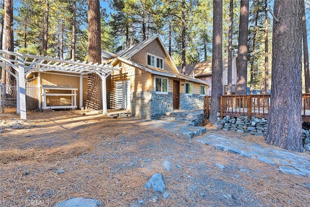 view of front of home featuring a deck and a pergola