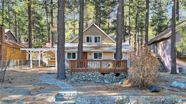 view of front of house with a pergola and a deck