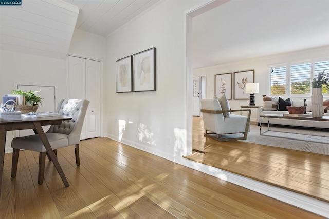 dining area featuring ornamental molding and hardwood / wood-style floors