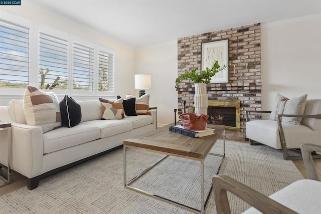 living room with crown molding and a fireplace