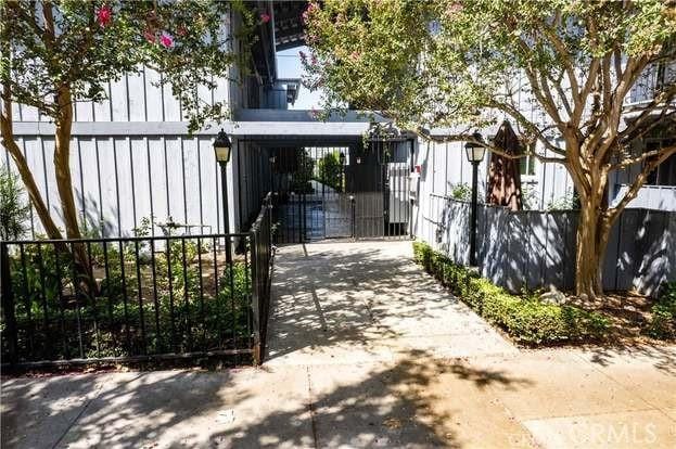 view of gate with a fenced front yard