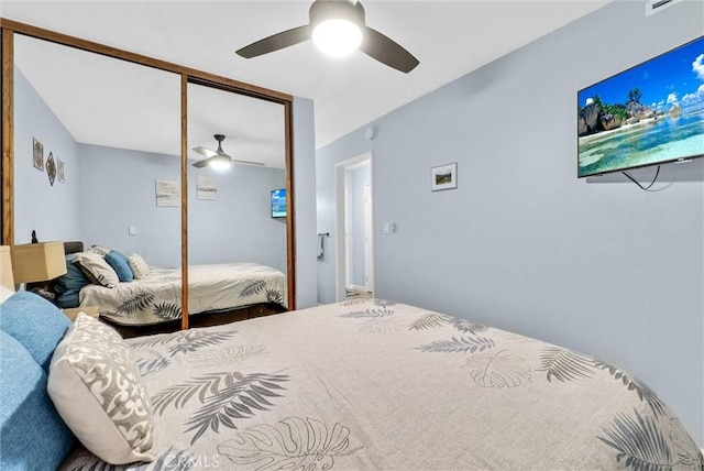 bedroom featuring ceiling fan and a closet