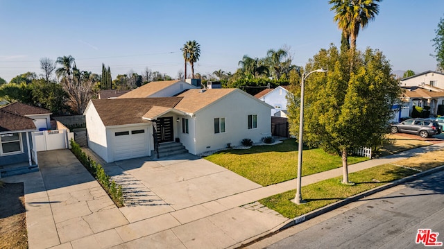 single story home featuring a garage and a front lawn