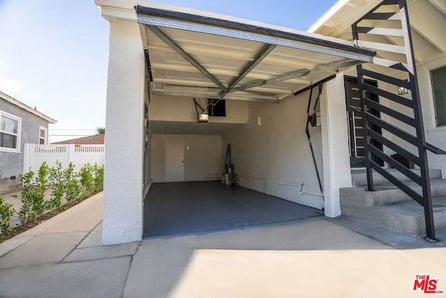 garage featuring a carport