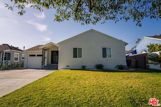 ranch-style house with a garage and a front yard