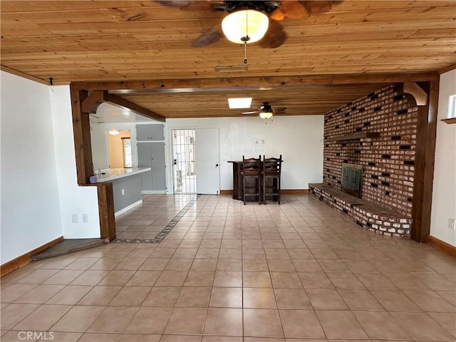 unfurnished living room featuring wood ceiling and light tile patterned floors