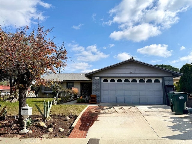 ranch-style house featuring a garage and a front lawn