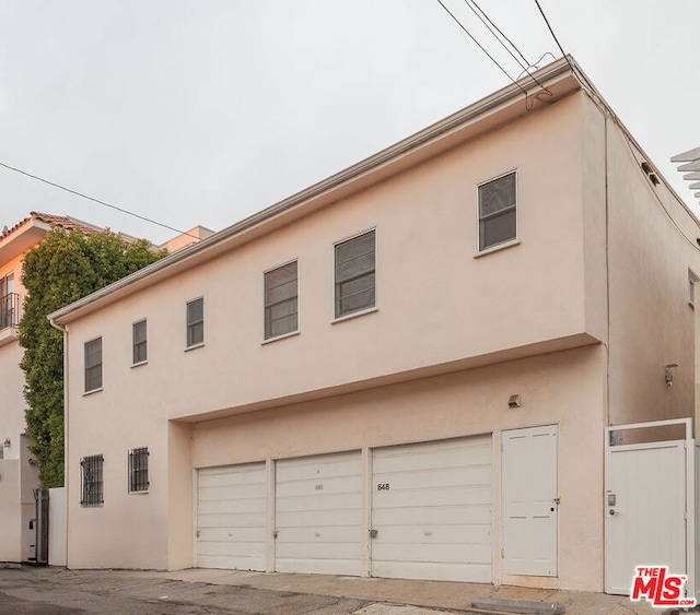 view of side of property featuring a garage