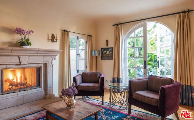 sitting room with hardwood / wood-style flooring