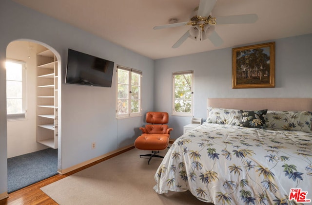 bedroom featuring ceiling fan and wood-type flooring