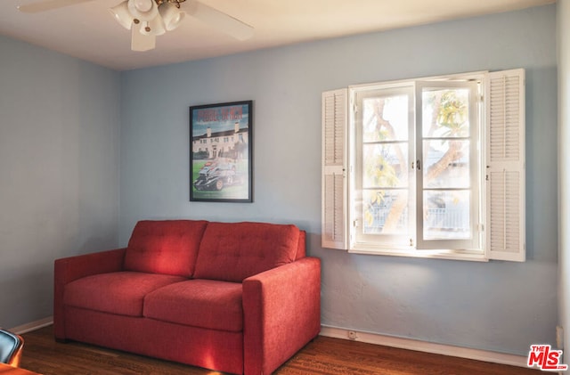 sitting room featuring ceiling fan and dark hardwood / wood-style floors