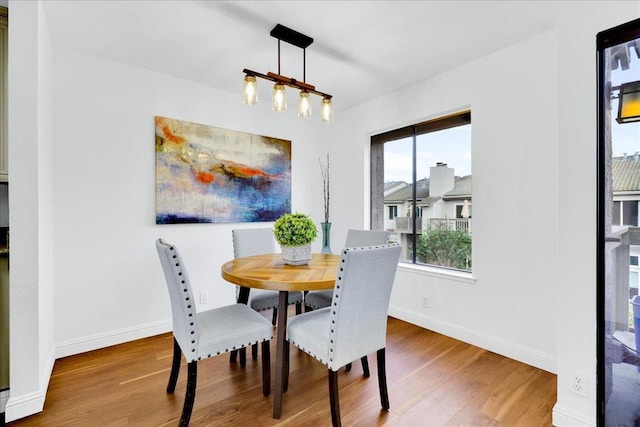 dining space featuring hardwood / wood-style floors