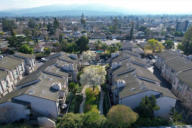 birds eye view of property with a mountain view