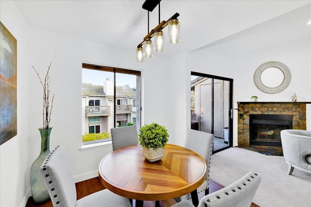 dining area with a tile fireplace