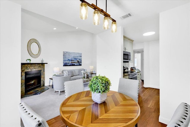 dining room with dark hardwood / wood-style floors