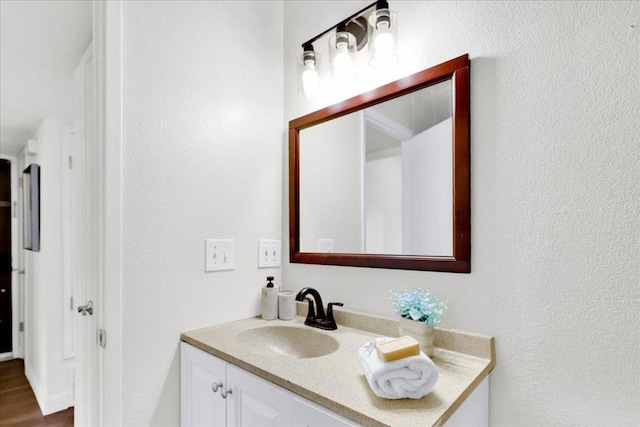 bathroom with vanity and wood-type flooring