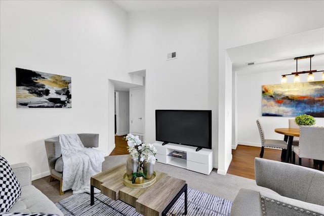 living room with a high ceiling