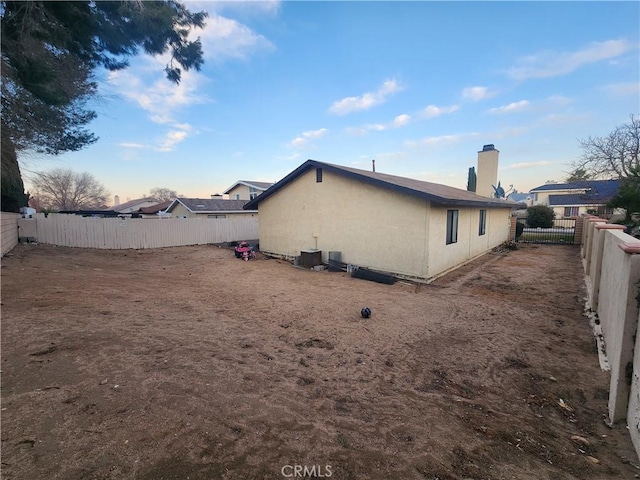 view of home's exterior with central AC