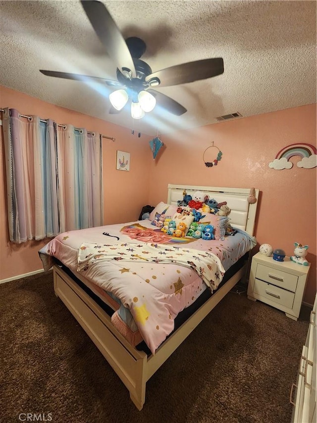 bedroom featuring ceiling fan, carpet flooring, and a textured ceiling