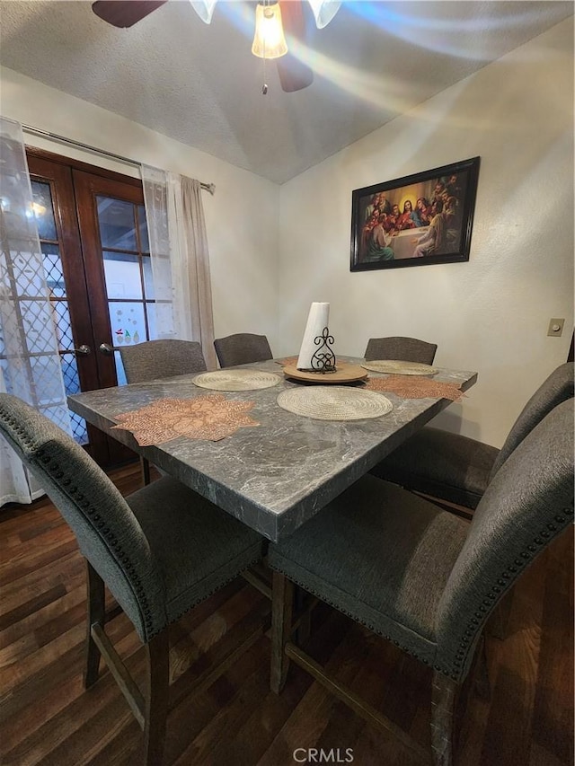 dining space with french doors, ceiling fan, and dark hardwood / wood-style flooring