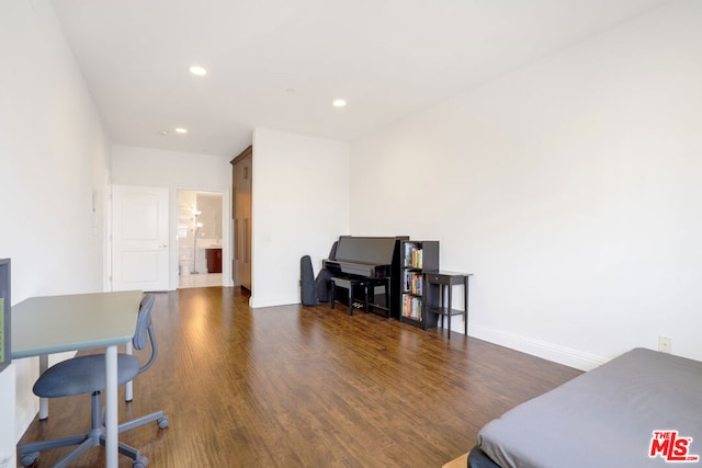 office with dark hardwood / wood-style flooring