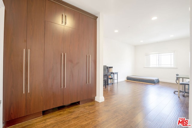 workout area with dark hardwood / wood-style floors