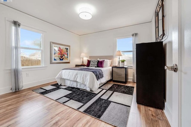 bedroom with light hardwood / wood-style floors