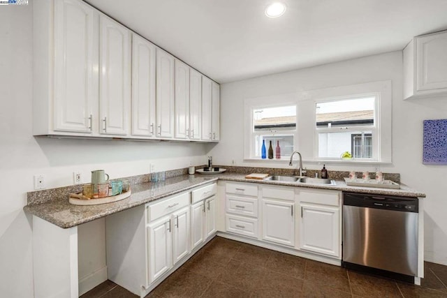 kitchen featuring white cabinetry, sink, and stainless steel dishwasher