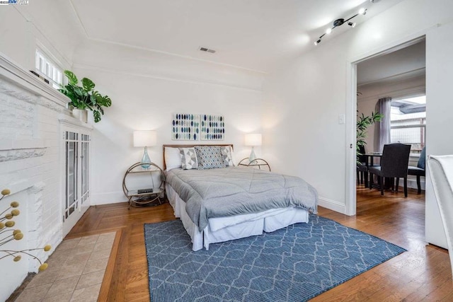 bedroom featuring wood-type flooring