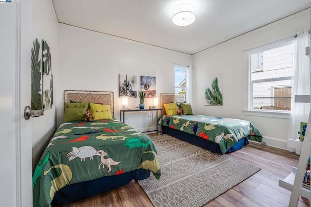 bedroom with wood-type flooring