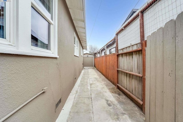 view of side of property with a patio area