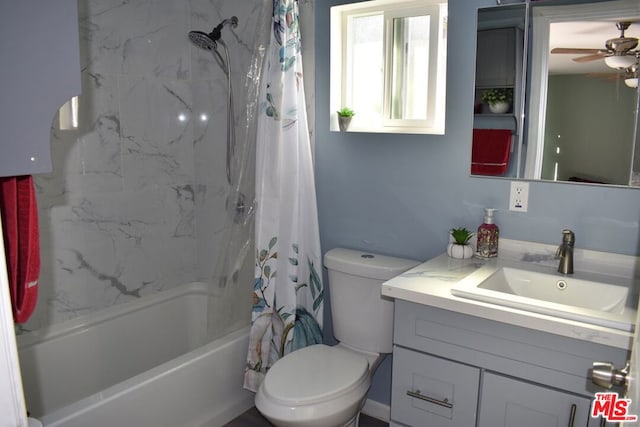 full bathroom with vanity, toilet, ceiling fan, and shower / bath combo with shower curtain