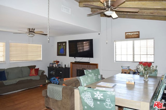 dining room featuring lofted ceiling, hardwood / wood-style floors, and ceiling fan