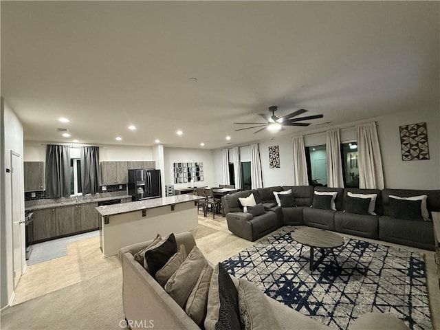 living room featuring ceiling fan