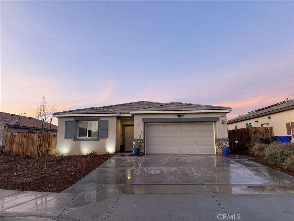 single story home with a garage