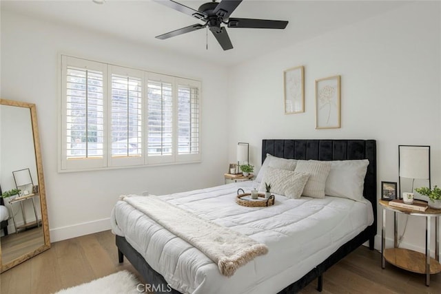 bedroom featuring ceiling fan and wood-type flooring