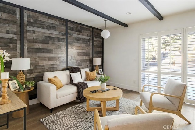 living room featuring hardwood / wood-style floors and beamed ceiling