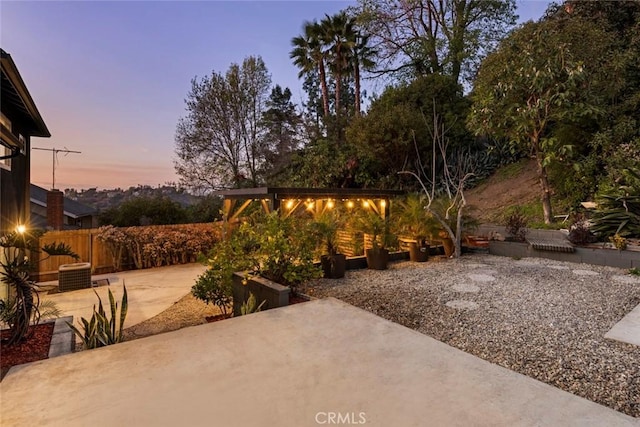 patio terrace at dusk with central AC unit