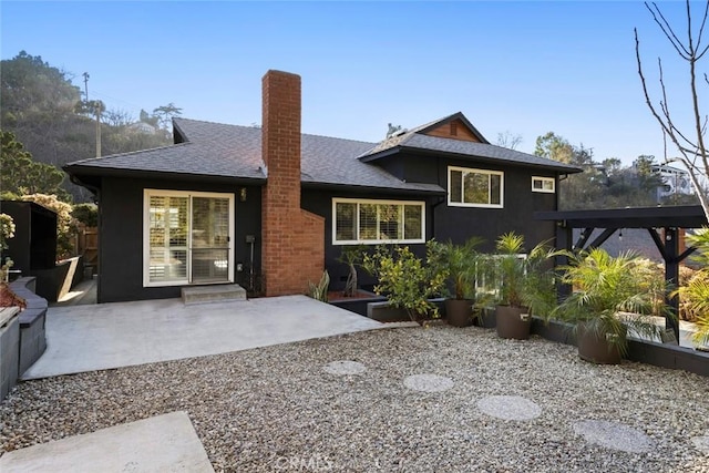 rear view of house with a patio