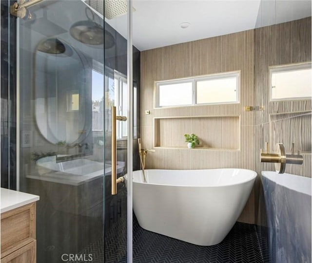 bathroom featuring vanity and separate shower and tub