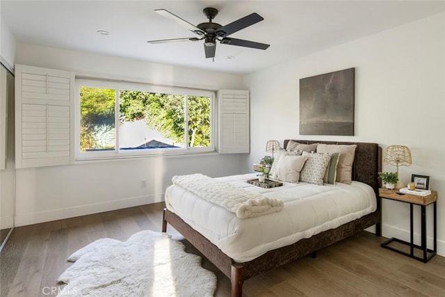 bedroom featuring hardwood / wood-style floors and ceiling fan