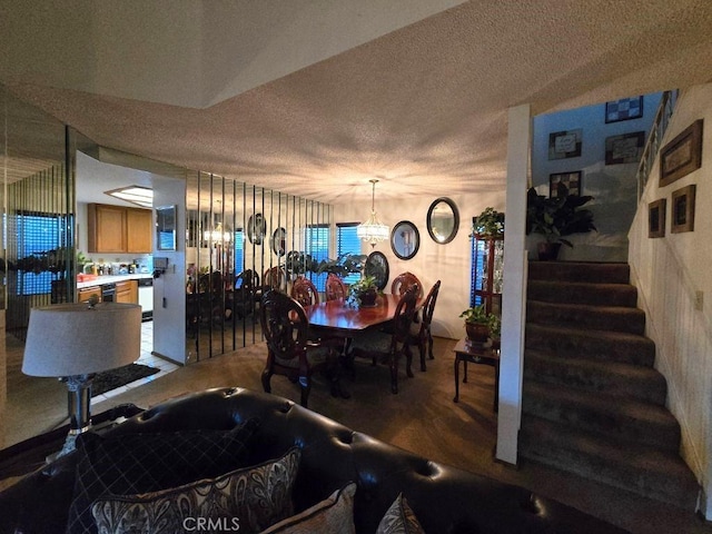 dining room featuring a textured ceiling